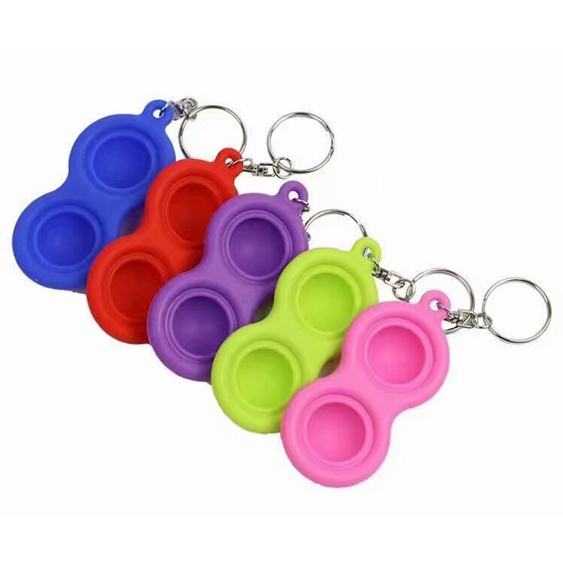 Mini giocattoli fidget portachiavi con fossetta semplice in silicone spingono i giocattoli fidget con bolle pop